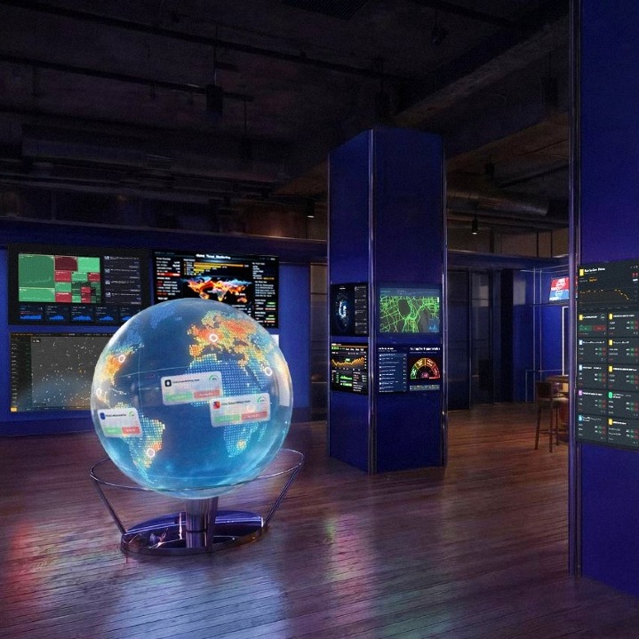 Un bar con pantallas que muestran noticias y bolsas de valores y una bola del mundo digital en el centro