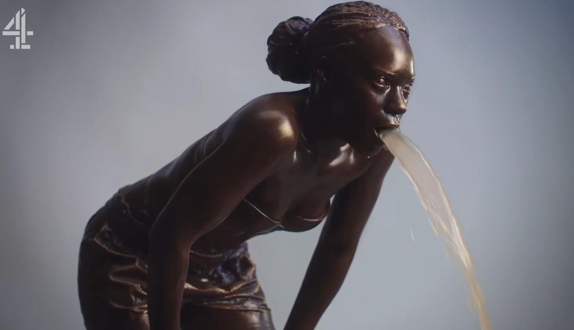 Estatua de una mujer vomitando agua sucia