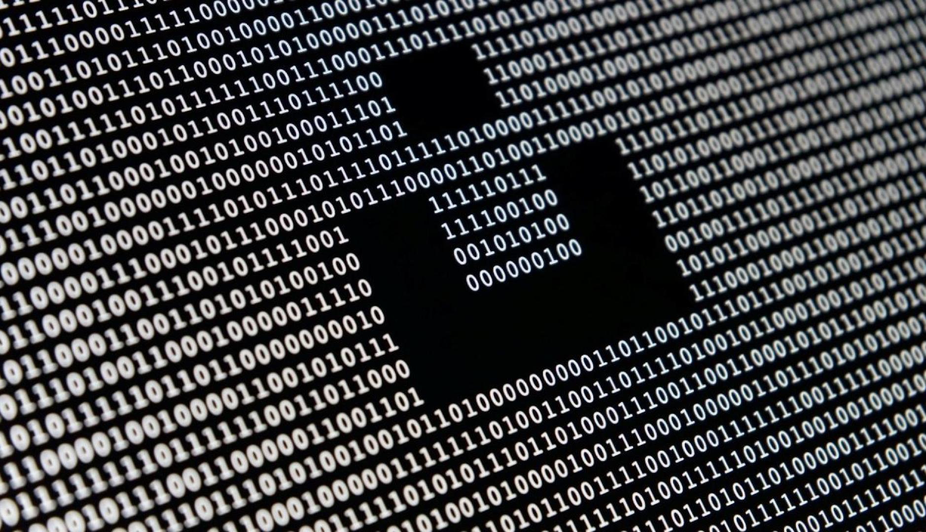 Un fondo negro con ceros y unos blancos a modo de código