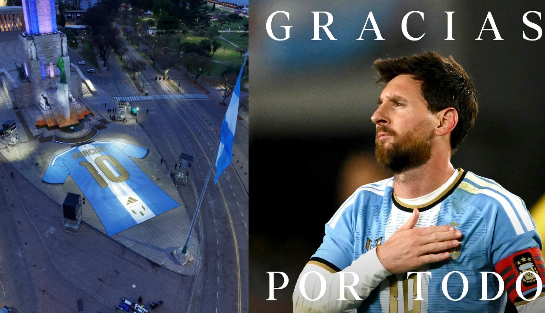 La camiseta gigante en un lado y al otro, Messi con la mano en el escudo