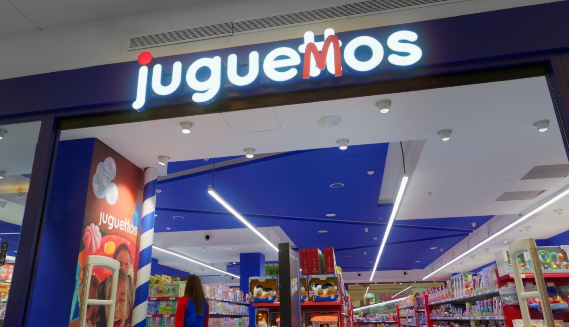 El rótulo de una tienda donde se lee Juguemos