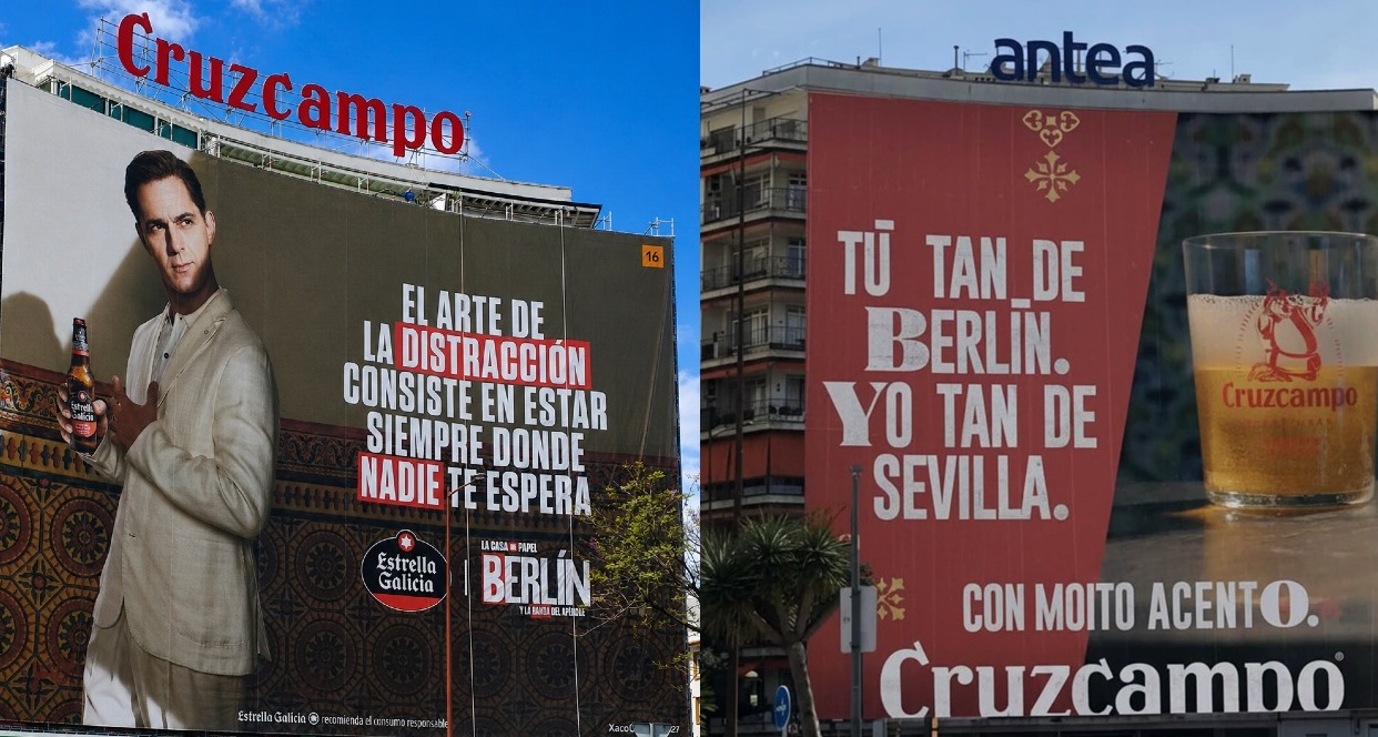 La lona de Estrella Galicia con Berlín y al lado la de Cruzcampo respondiendo